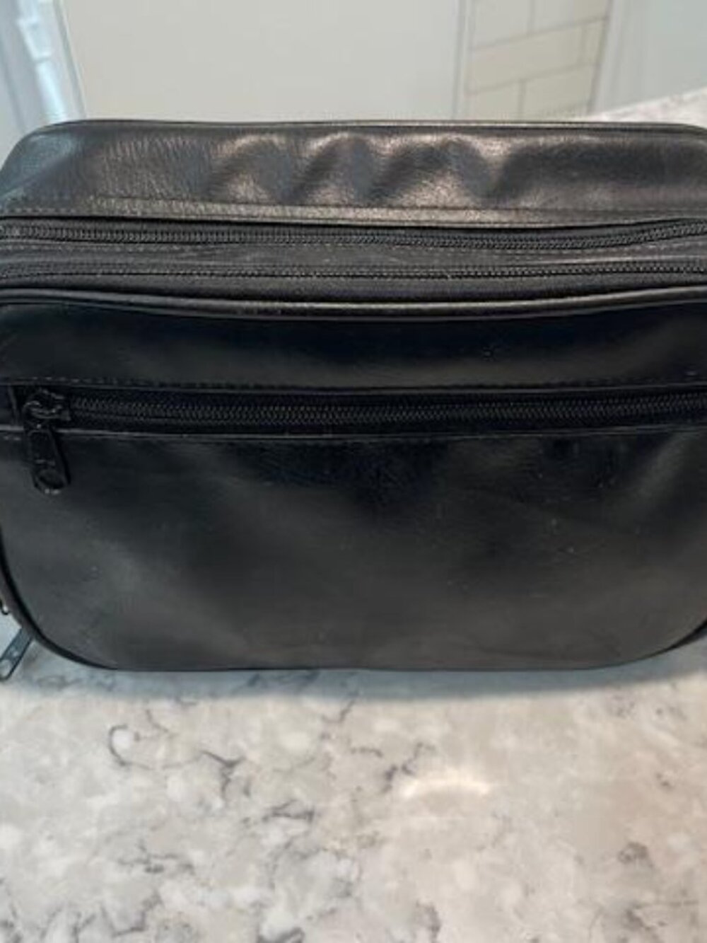 A Gentleman's Black Traveling Cosmetic Bag w/3 Zipper Pockets & Interior Pockets
